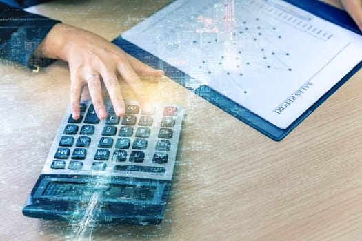 Double exposure of businesswoman hand with calculator and New york skyline building background