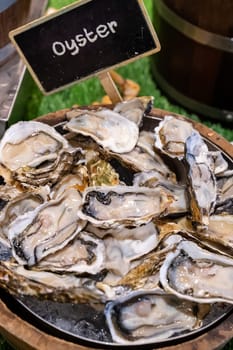 Fresh Oyster serve in wooden bucket