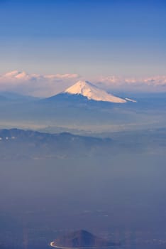 Aerial view of Fuji san, Mountain Fuji, landmark mountain of Japan. Take from Airplane while fly pass Fuji City Shizuoka Japan