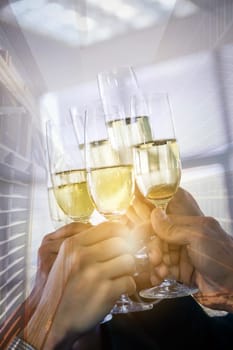 Double exposure of hand with champagne business celebration with skyline building background