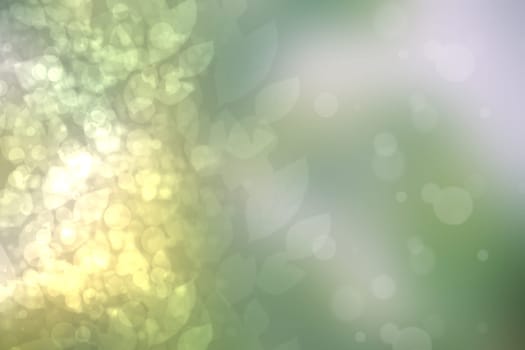 Abstract gradient green light and yellow colorful pastel spring or summer bokeh background with leaves and circular lights. Beautiful texture.
