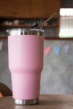 Thermos tumbler mug that made of stainless steel with metal drinking straw, stock photo