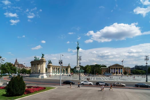 Budapest, Hungary - July 04, 2019: Heroes Square with Millenium Memorial and the horseman Memorial is one of the major squares in Budapest. Panorama with tourists and visitors.