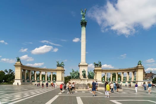 Budapest, Hungary - July 04, 2019: Heroes Square with Millenium Memorial and the horseman Memorial is one of the major squares in Budapest. Panorama with tourists and visitors.