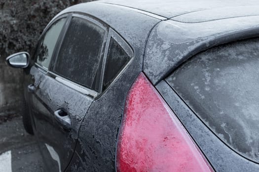 Frozen in the ice black car. Hoarfrost. Icy Accumulation. Ideal for concepts.