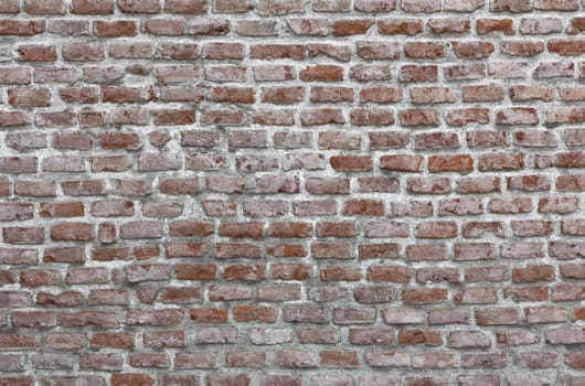 Old Red Bricks wall, they have faded over time. Ideal for texture and backgrounds.
