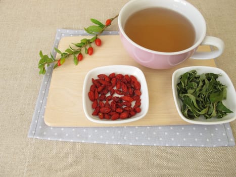 Tea with dried goji berries and goji leaves