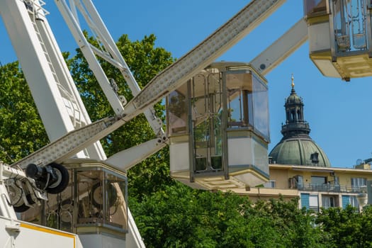 Budapest, Hungary - July 05, 2019: Luminous Ferris wheel in night city. Budapest Eye at night. Sziget Eye. The new Ferris Wheel opened on Erzsébet Square in mid-march 2017 and it will operate throughout the year.