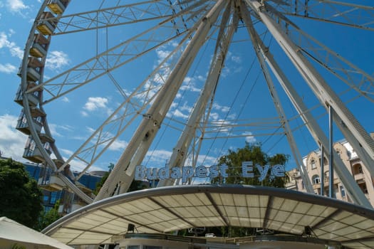 Budapest, Hungary - July 05, 2019: Luminous Ferris wheel in night city. Budapest Eye at night. Sziget Eye. The new Ferris Wheel opened on Erzsébet Square in mid-march 2017 and it will operate throughout the year.