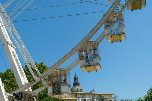 Budapest, Hungary - July 05, 2019: Luminous Ferris wheel in night city. Budapest Eye at night. Sziget Eye. The new Ferris Wheel opened on Erzsébet Square in mid-march 2017 and it will operate throughout the year.