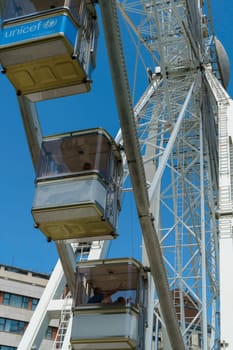 Budapest, Hungary - July 05, 2019: Luminous Ferris wheel in night city. Budapest Eye at night. Sziget Eye. The new Ferris Wheel opened on Erzsébet Square in mid-march 2017 and it will operate throughout the year.