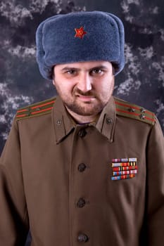young man dressed as russian military, studio