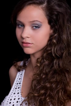 young beautiful brunette portrait against black background
