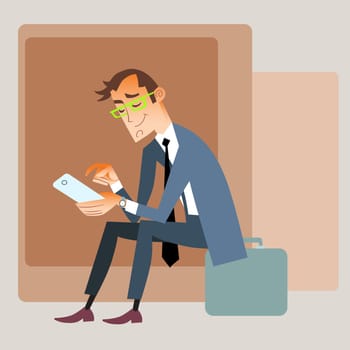 Businessman traveler in a suit sitting on the bag and reads smartphone