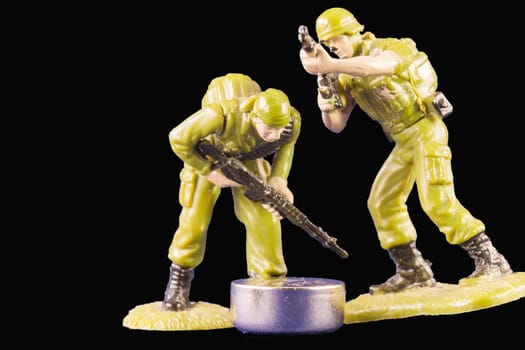 Discovery of a battery. Small toy soldiers found a battery