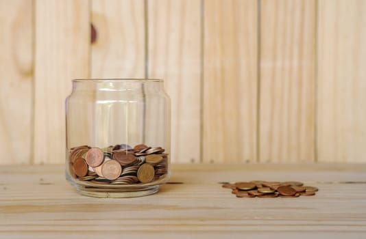 Save money and account banking for finance business concept, Coin money on blurred wooden background