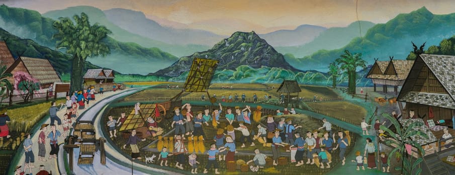 CHIANG MAI,THAILAND - OCTOBER 27, 2014 : Thai mural painting of Lanna people life in the past of harvest festival (traditional paddy field threshing rice by hands) on temple wall of Wat Chaimongkol Temple in Chiang Mai, Thailand.