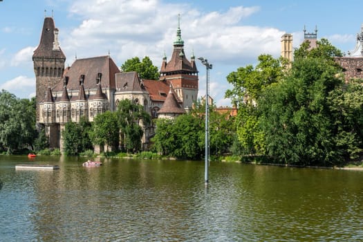 Budapest, Hungary - July 04, 2019: The Vajdahunyad castle, built to celebrate the Millennium, perfectly illustrates the different architectural styles that characterize Hungary. It is partly inspired by the castle of Honedoara (Transylvania, Romania).