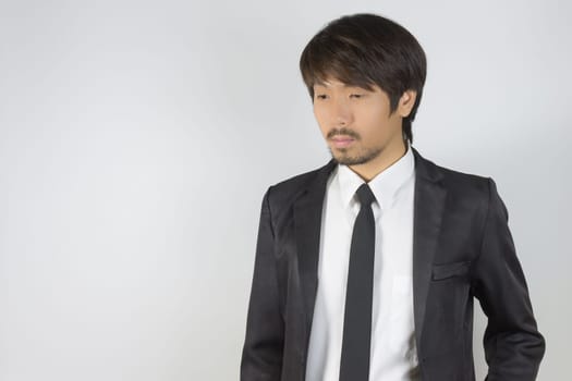 Portrait Businessman in Black Suit on Right Frame. Portrait businessman wear white shirt and suit in smart pose style