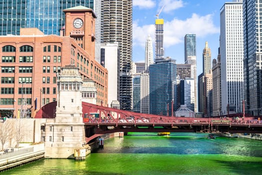 Chicago Skylines building along green dyeing river of Chicago River on St. Patrick day festival in Chicago Downtown IL USA
