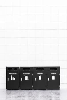 Recycle bins for rubbish, recycling and garden waste, over white wall background