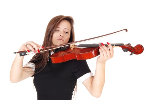 A beautiful woman standing in a black dress playing her violin .with her eyes closed, isolated for white background.