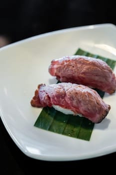 Wagyu beef sushi, japanese groumet cuisine, on white plate