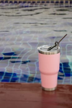 Thermos tumbler mug that made of stainless steel with metal drinking straw, stock photo