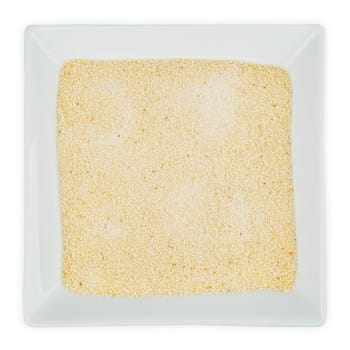 Semolina grain in a bowl isolated on white background
