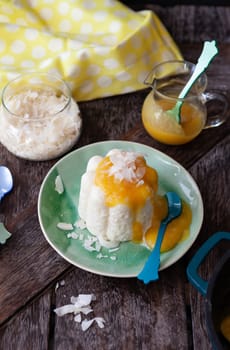 Exotic vegan rice pudding with coconut and mango sauce