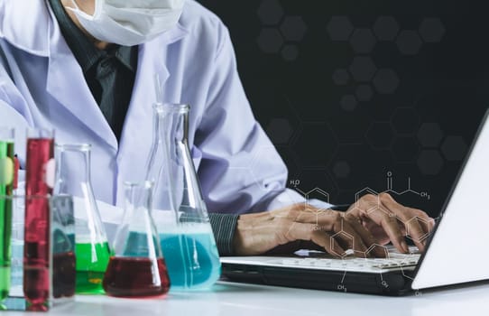Researcher with glass laboratory chemical test tubes with liquid for analytical , medical, pharmaceutical and scientific research concept.