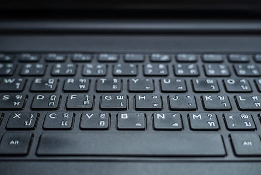 Technology and connecting concept, Keyboard on notebook computer blurred background