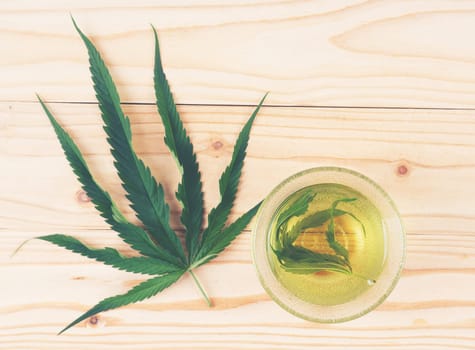 marijuana herbal tea served in glass teacup