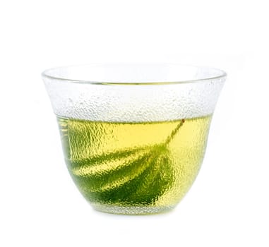 marijuana herbal tea served in glass teacup