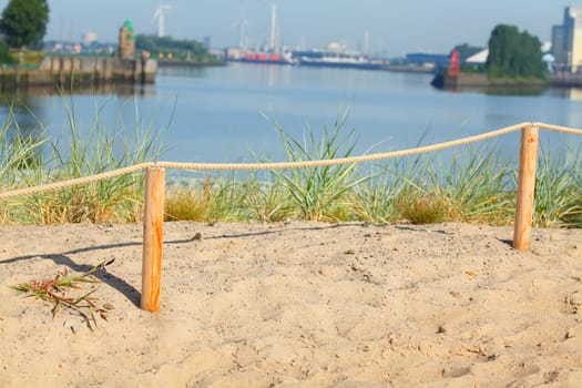Sand dunes with path and fence, Germany, Europe..