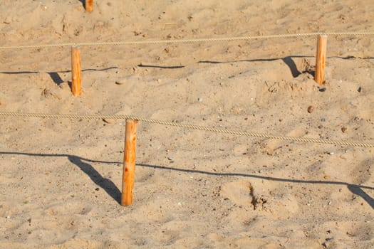 Sand dunes with path and fence, Germany, Europe..