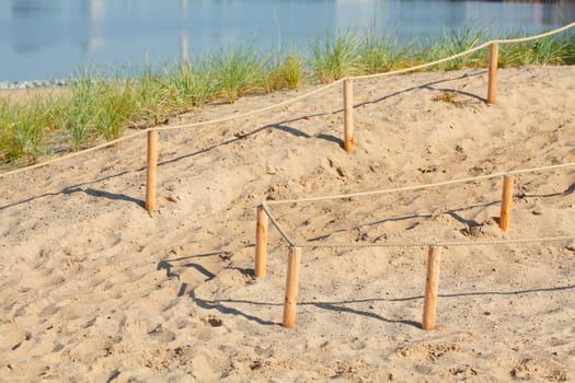 Sand dunes with path and fence, Germany, Europe..