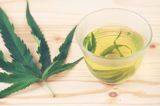 marijuana herbal tea served in glass teacup
