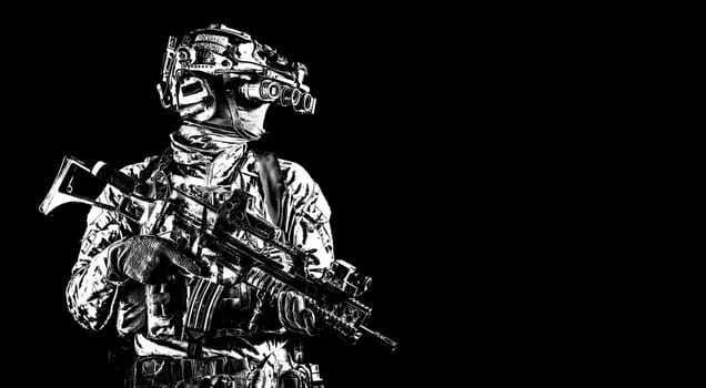 Half length portrait of army special forces rifleman, commando elite soldier equipped radio tactical headset, armed service rifle, using night vision goggles in darkness, isolated on black, copyspace