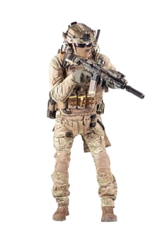 Army infantryman in camouflage uniform, battle helmet, tactical radio headset, extra ammo on load carrier, sneaking, aiming with laser sight on assault rifle studio shoot isolated on white background