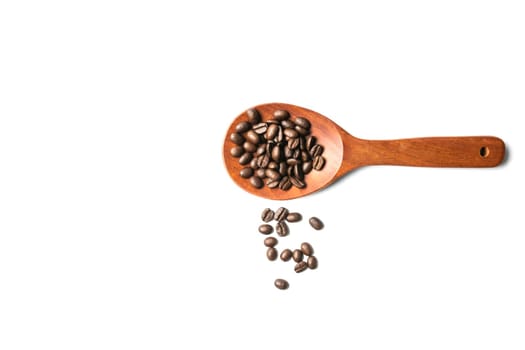 A wooden spoon with spread coffee beans isolated on white background and copy space