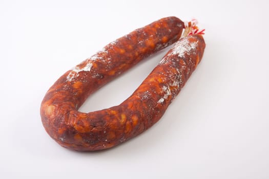 Red spanish chorizo sausage. Isolated over white background