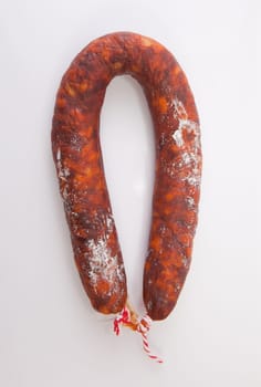 Red spanish chorizo sausage. Isolated over white background
