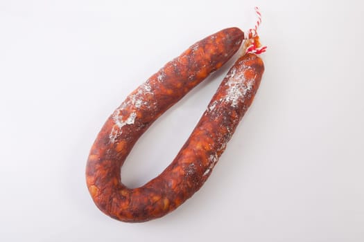 Red spanish chorizo sausage. Isolated over white background