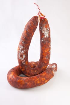 Two red spanish chorizos. Isolated over white background