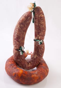 Red and white iberian salchichon. Isolated over white background