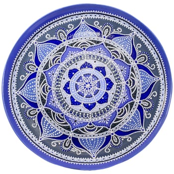Decorative ceramic dish painted with hands. Art, handmade. Pattern mandala