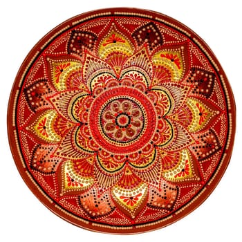 Decorative ceramic dish painted with hands. Art, handmade. Pattern mandala