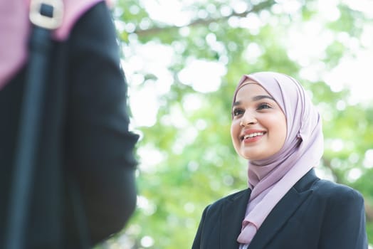 Beautiful Muslim business woman talking and smile.