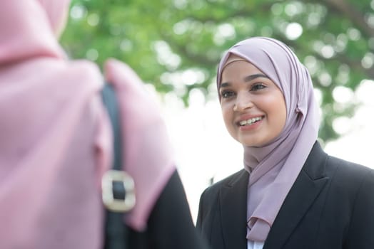 Beautiful Muslim business woman talking and smile.